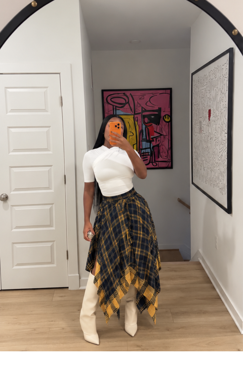 Woman wearing Demuluxe Zora Skirt, a plaid maxi skirt with asymmetric handkerchief hem