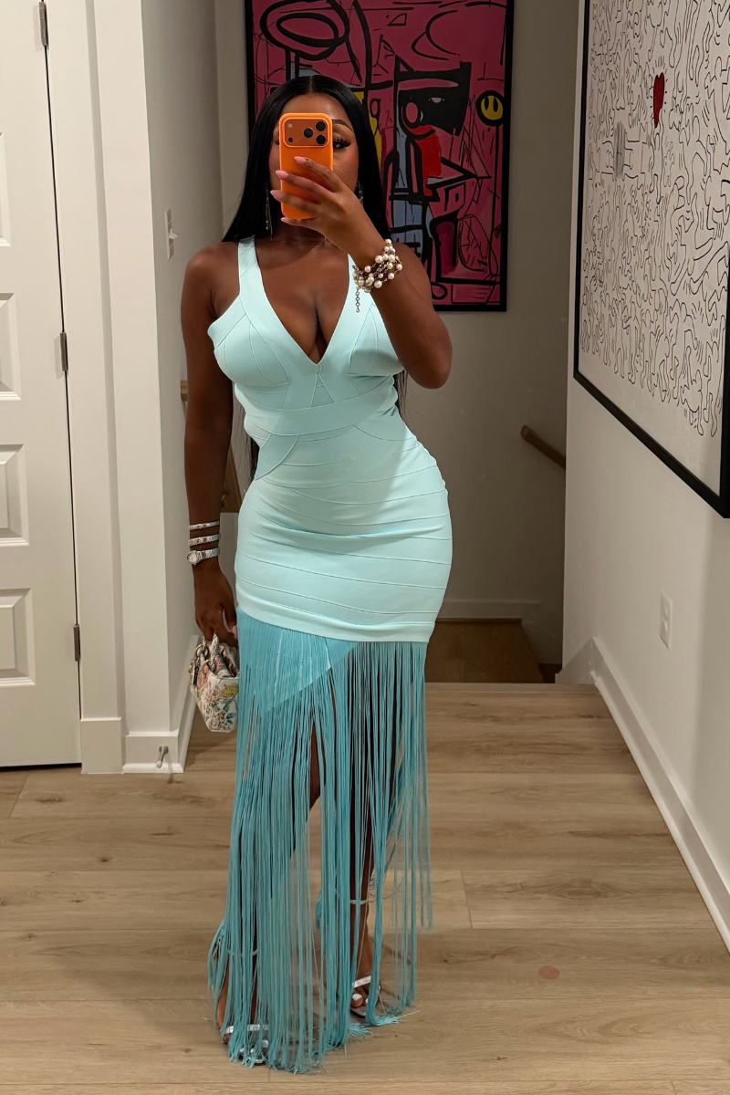 Woman wearing Demuluxe Sable Fringe Dress, a bandage bodycon dress with plunge neckline and fringe skirt overlay