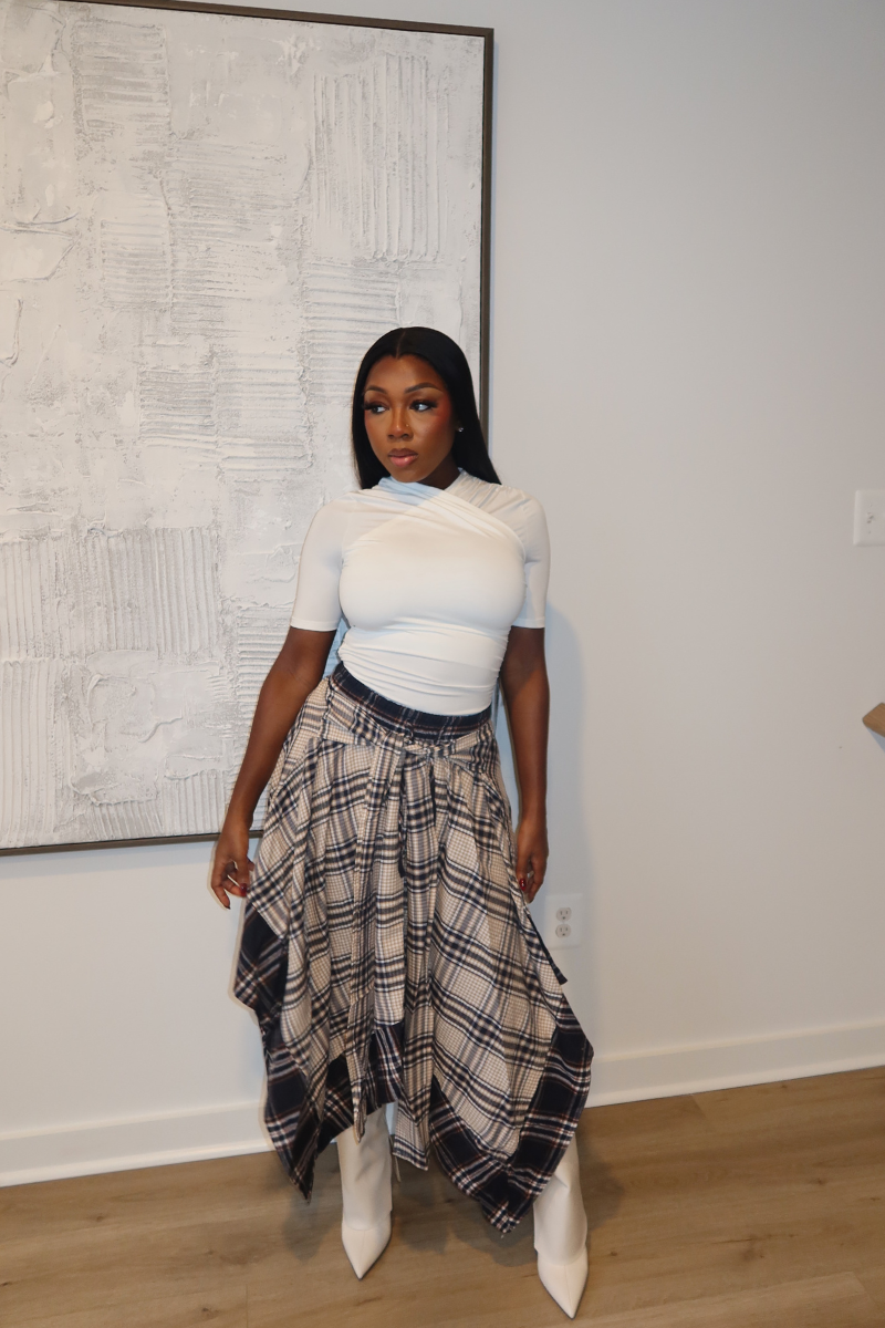 Woman wearing Demuluxe Zora Skirt, a plaid maxi skirt with asymmetric handkerchief hem