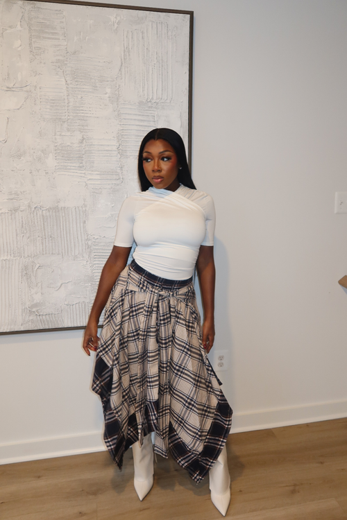 Woman wearing Demuluxe Zora Skirt, a plaid maxi skirt with asymmetric handkerchief hem