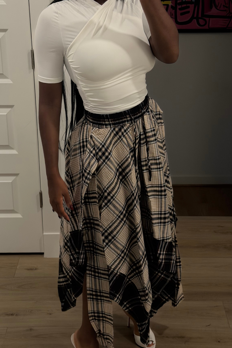 Woman wearing Demuluxe Zora Skirt, a plaid maxi skirt with asymmetric handkerchief hem